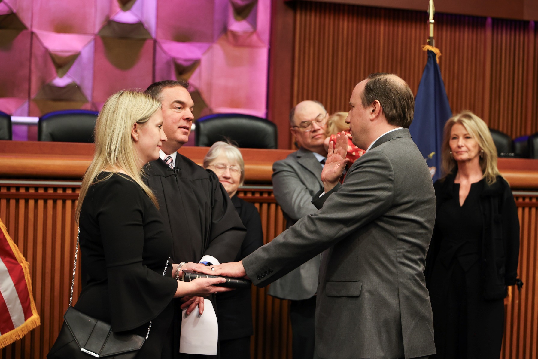 (Photo submitted) State Supreme Court Justice Raymond W. Walter administers the Oath of Office to Assemblyman Joe Sempolinski as Assemblyman Sempolinski’s wife, Angie, holds the Bible and his family looks on.