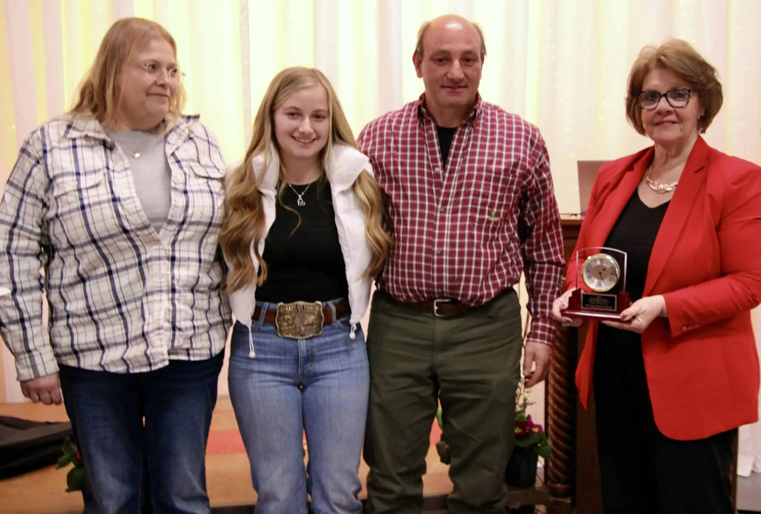 (Rick Miller/Olean Star) Cattaraugus County Farmer-Neighbor Dinner Farm of the Year honors went to Williams Ranch and Cattle of Randolph. From left are Kim Williams, Alysa Williams, Jeff Williams and Crystal Abers, presenter.