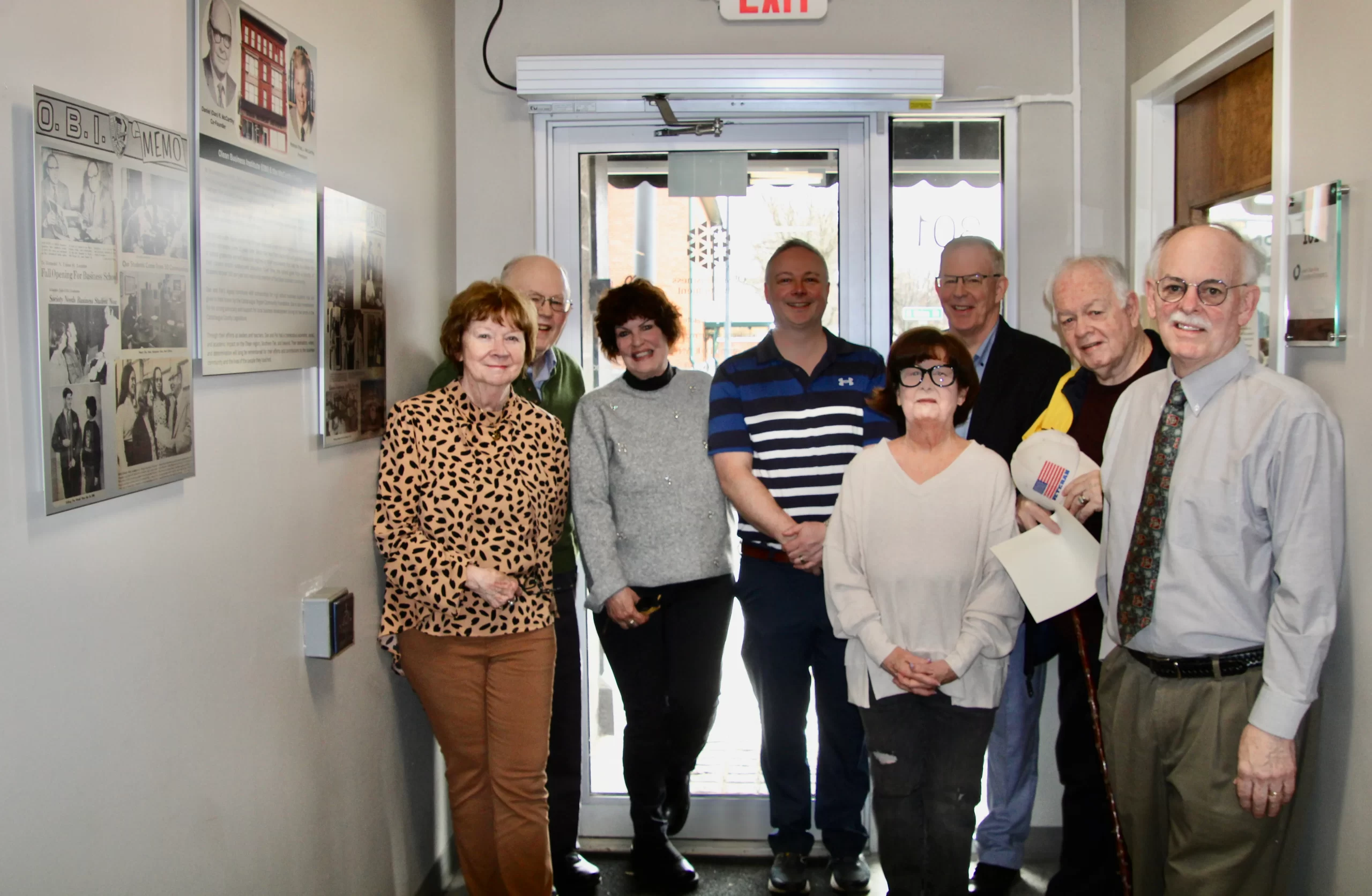 (Rick Miller/Olean Star) McCarthy family members attended the unveiling of a commemorative display featuring Dan and Pat McCarthy Friday at the former Olean Business Institute Building. From left are Judi McCarthy, Jim McCarthy, Jean McCarthy, Mike McCarthy, Marianne McCarthy, John McCarthy, Dan McCarthy and Kevin McCarthy.