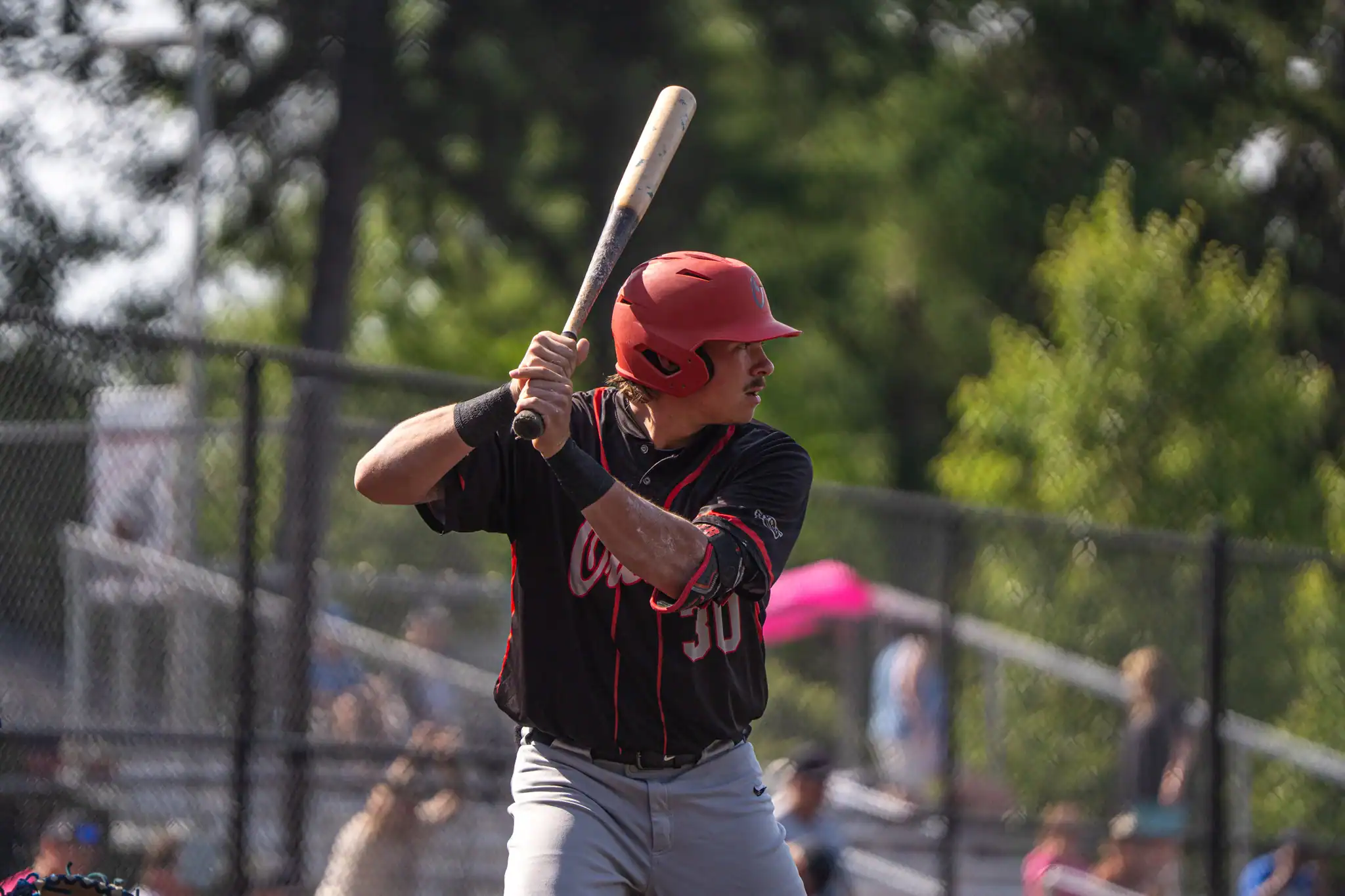 FILE -- Olean's Chase Fischer stares down a pitch during the Oilers' double-header loss to Salamanca on Saturday. Against the Hitmen on Tuesday, Fischer scored once as Olean fell to 7-5. | File photo by Hunter O. Lyle
