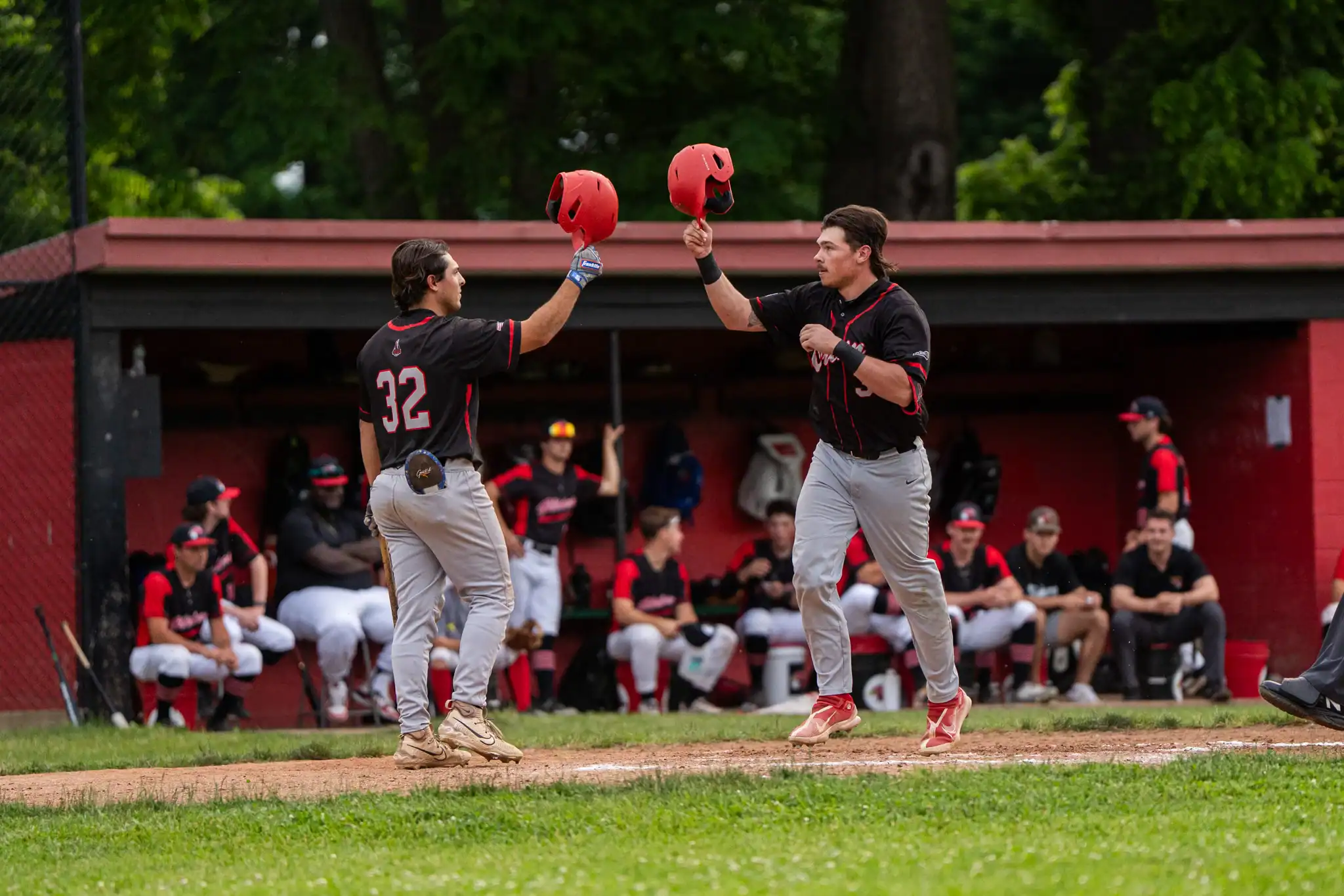 Olean's Chase Fischer (right) celebrates at home plate with Ryan Cainzos after hitting the Oilers' first home run of the season during their win over the Dansville Gliders. | Photo by Hunter O. Lyle