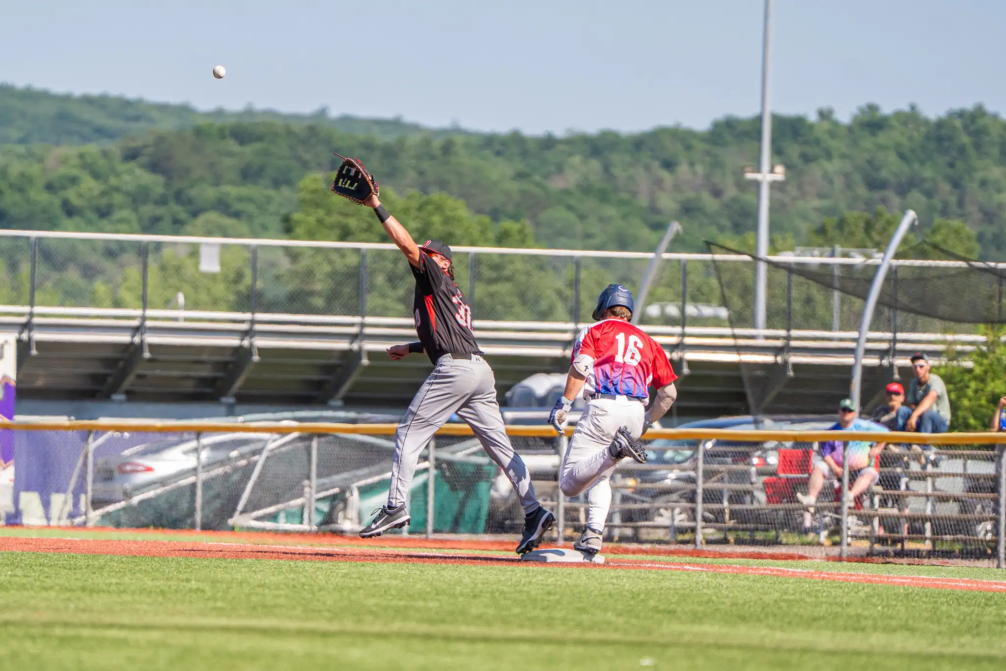 Oilers first basemen Chase Fischer stretches out for a snag during Olean's 7-7 tie with the Genesee Rapids on Sunday. | Photo by Hunter O. Lyle