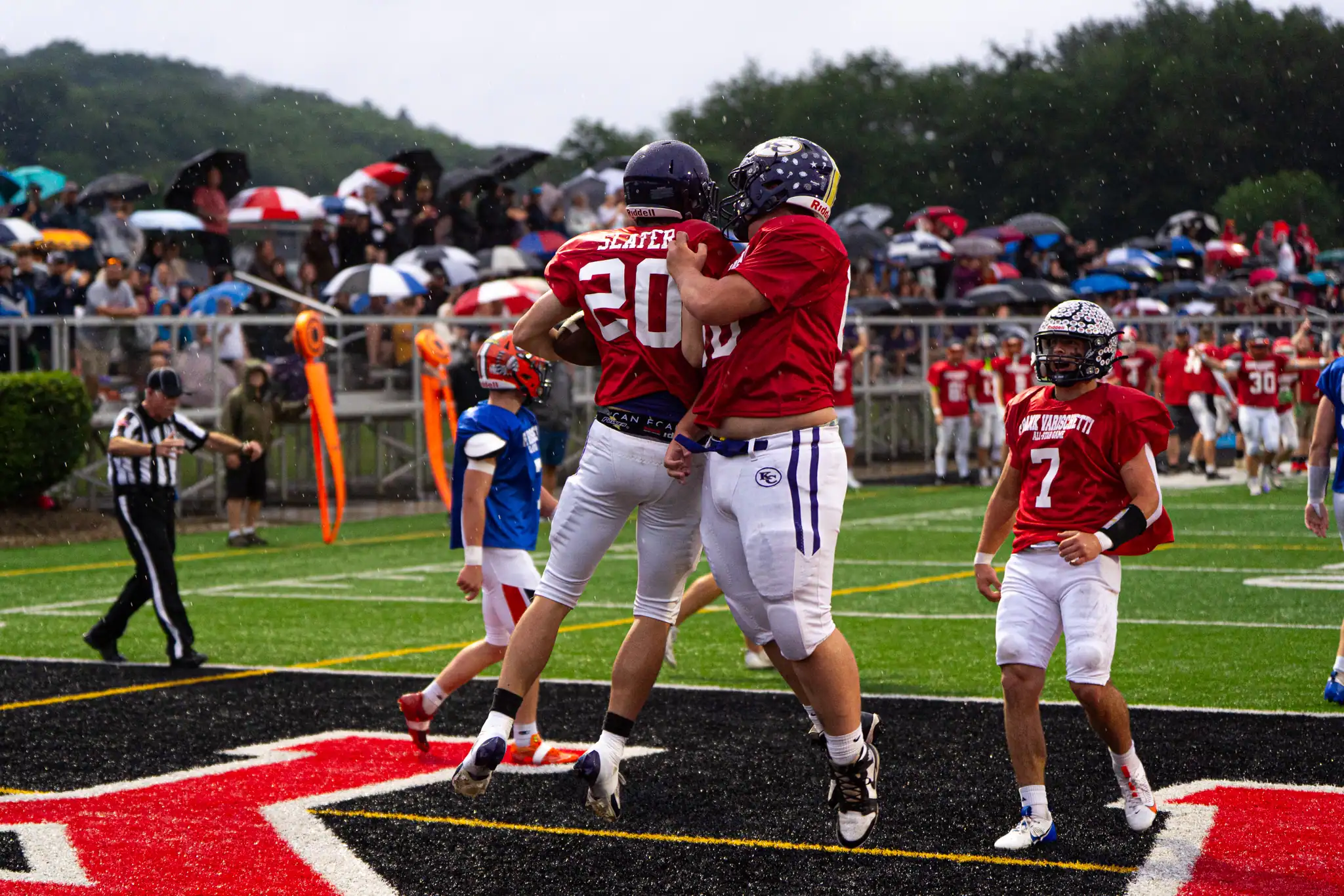 Braden Slater celebrates with his South teammates after scoring one of their team's six touchdowns in the 10th annual Varischetti All-Star football game. | Photo by Hunter O. Lyle