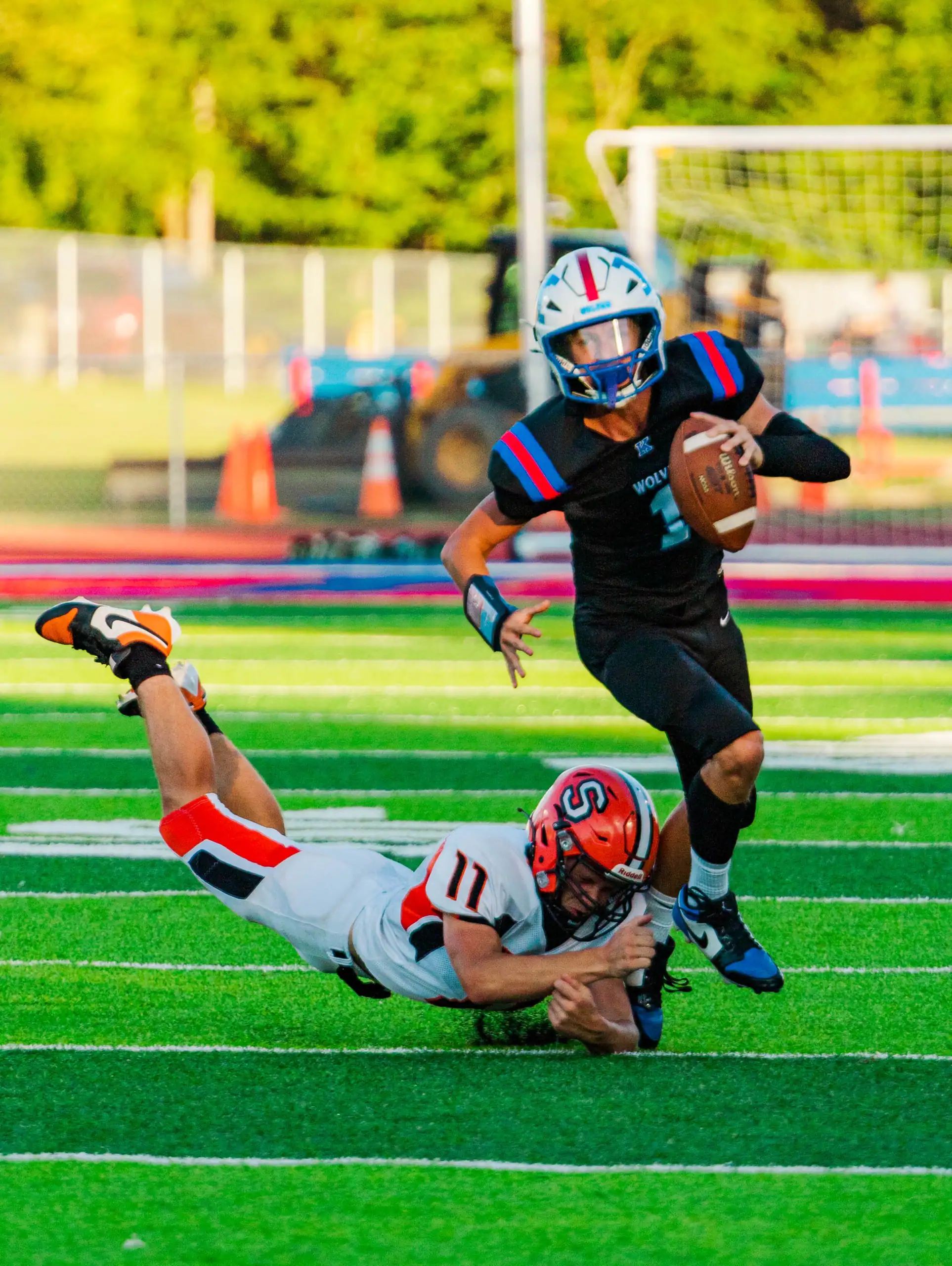 Smethport's Trent Tanner (11) grabs at Kane's Eric Novosel during Smethport's season-opening loss. | Photo by Hunter O. Lyle
