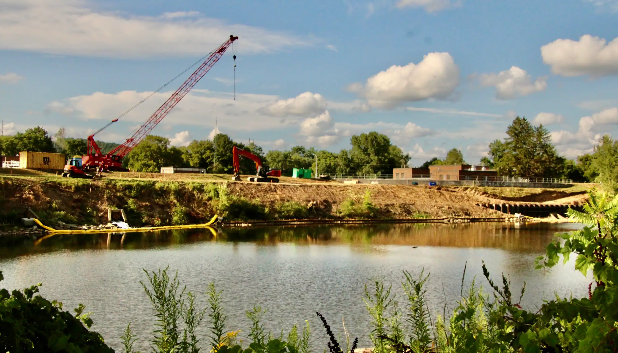(Rick Miller/Olean Star) A large crane used to drive steel piling along the Allegheny River shoreline near the Olean Wastewater Treatment Plant sits near the levee outside the plant. More than 1,000 feet of the levee are being strengthened in a project paid for by New York State.