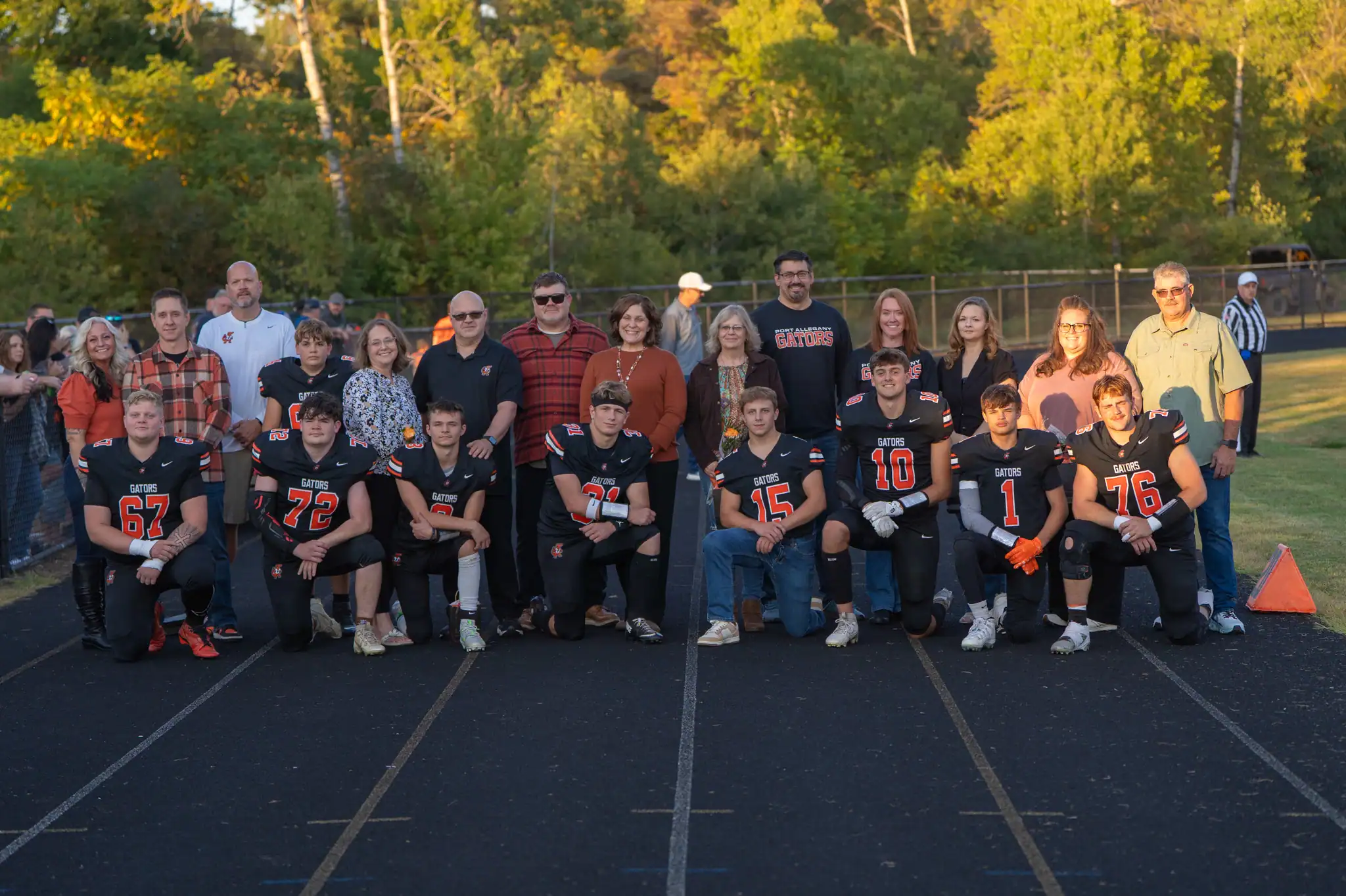 Ahead of their game against the Hubbers, Port Allegany honored their eight seniors. Pictured here with their families are Brayden Babcock (left to right), Patrick McMahon, Nick Wilfong, Aiden Bliss, Tristan Kiser, Jarrod Funk, Julian Kaple and Ethan Tarbox. | Photo by Hunter O. Lyle