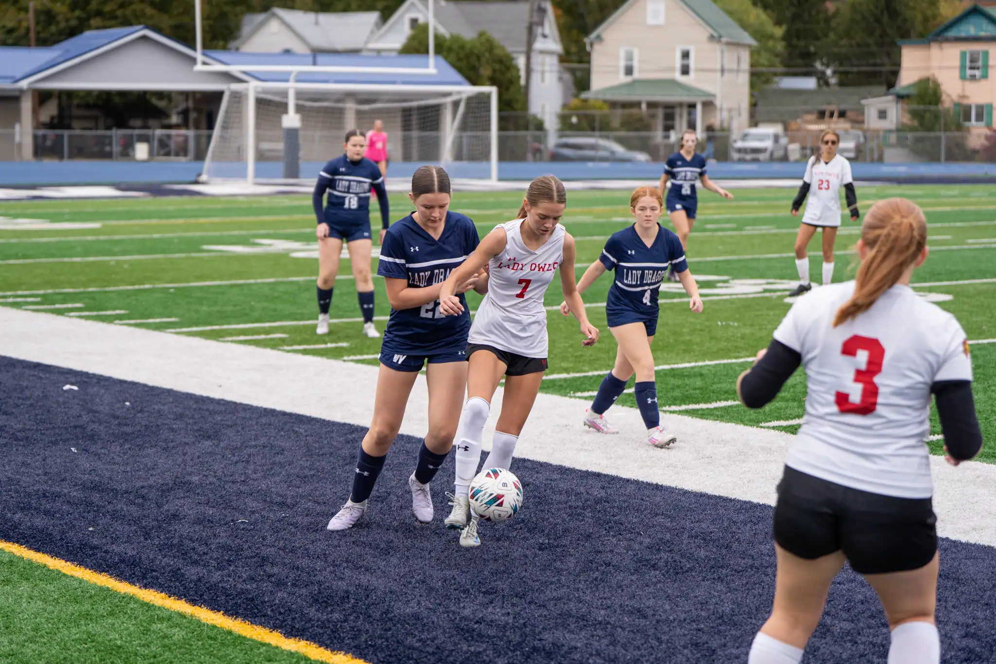 Alyssa Mangold fights a Warren defender from possession. In her third game back from injury, Mangold led Bradford to a 3-0 win over the Lady Dragons with a hat trick. | Photo by Hunter O. Lyle