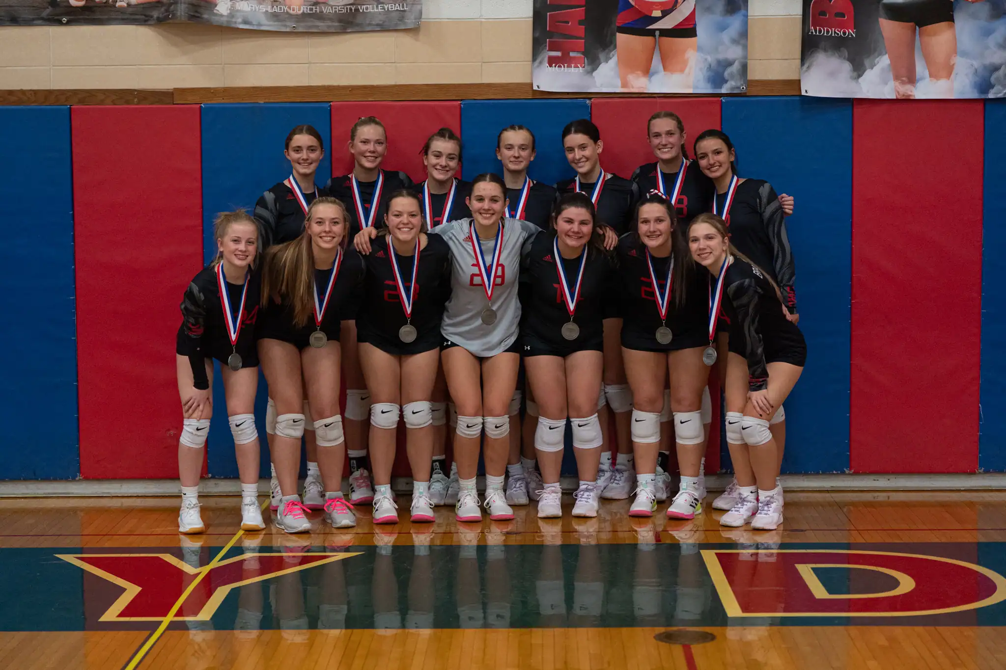 The Bradford volleyball team poses with their newly-acquired silver medals after losing to DuBois in the District 9 Class 3A championship. | Photo by Hunter O. Lyle