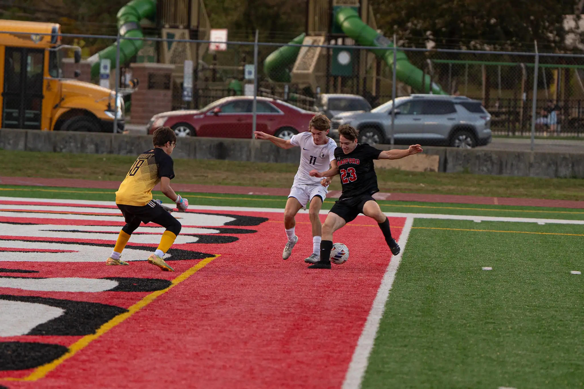 Bradford's Jackson Nannen (23) fights for possession in the box against McDowell's Roman DiSanto during the Owls' 10-2 loss to the Trojans.