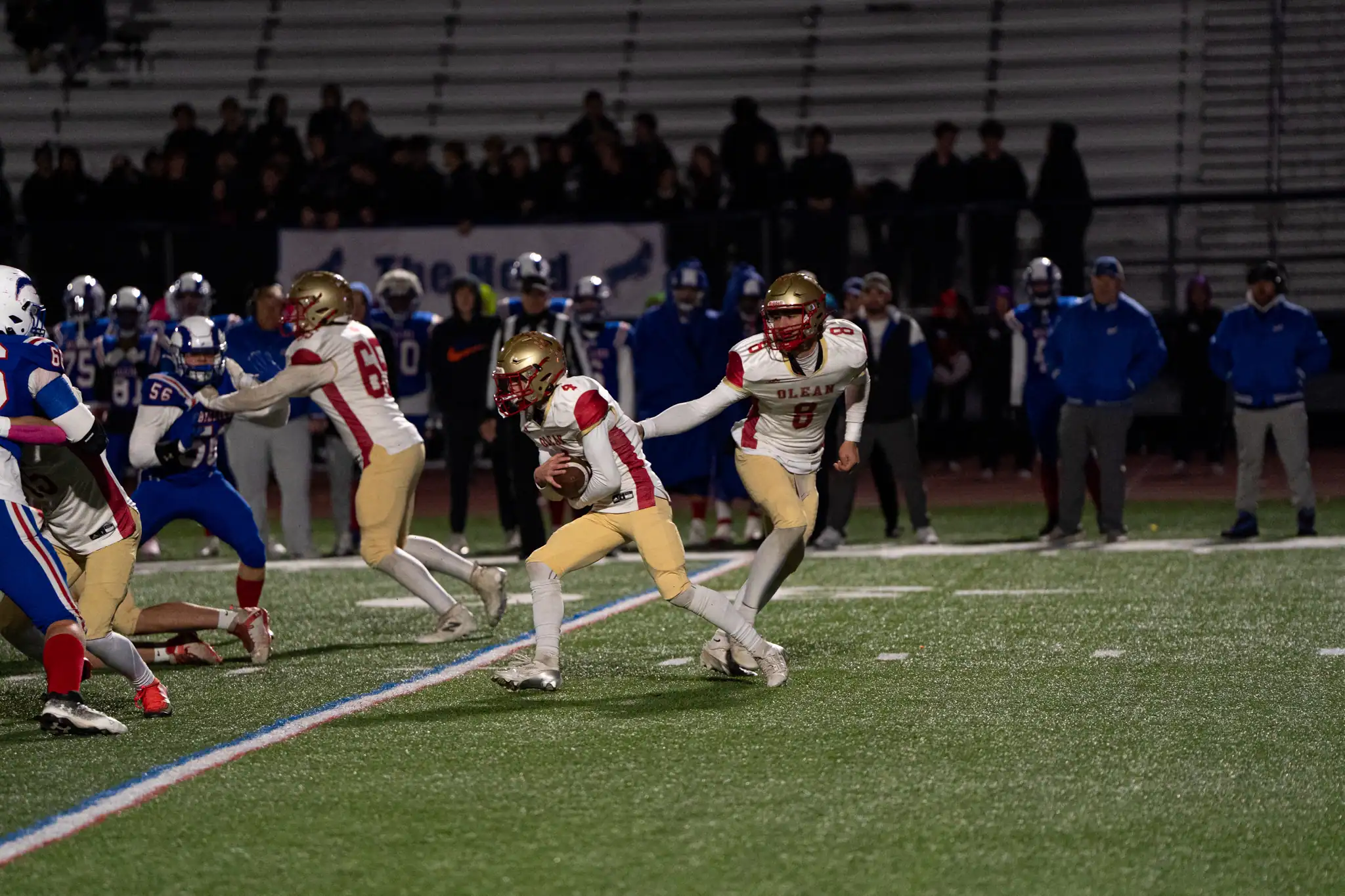Olean's Domonick Hirliman takes the handoff from Joe Mest during the Huskies' playoff matchup against Williamsville South. Hirliman led the Huskies offense, getting the ball 24 times for 117 rushing yards. | Photo by Hunter O. Lyle