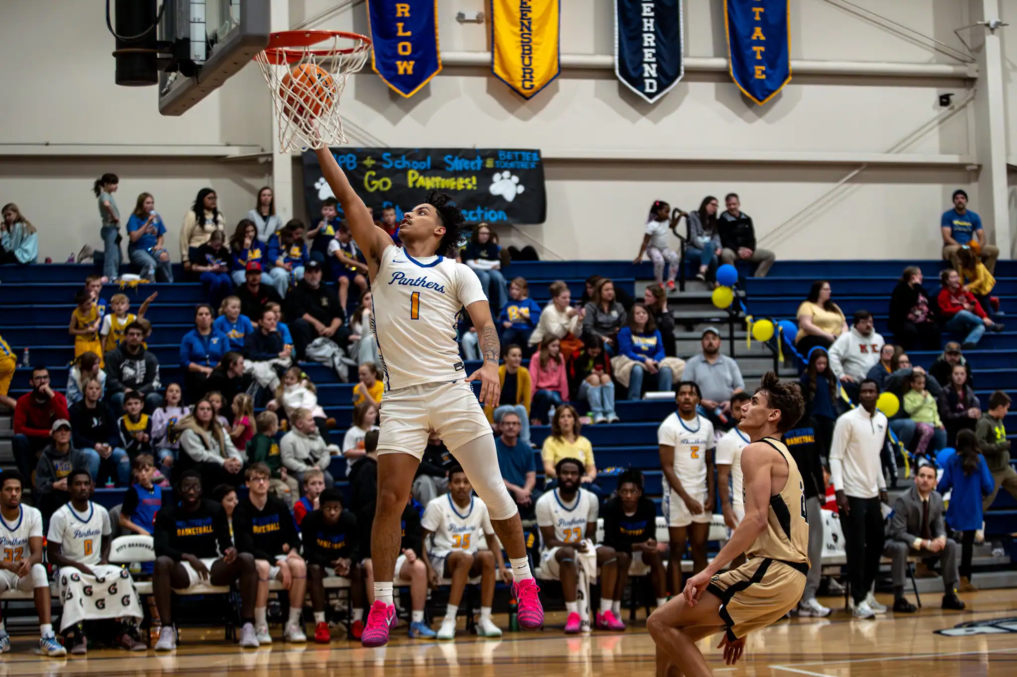Jeremy Rodriguez takes the ball to the rim during his career night against Geneva. | Photo by Taylor Komidar