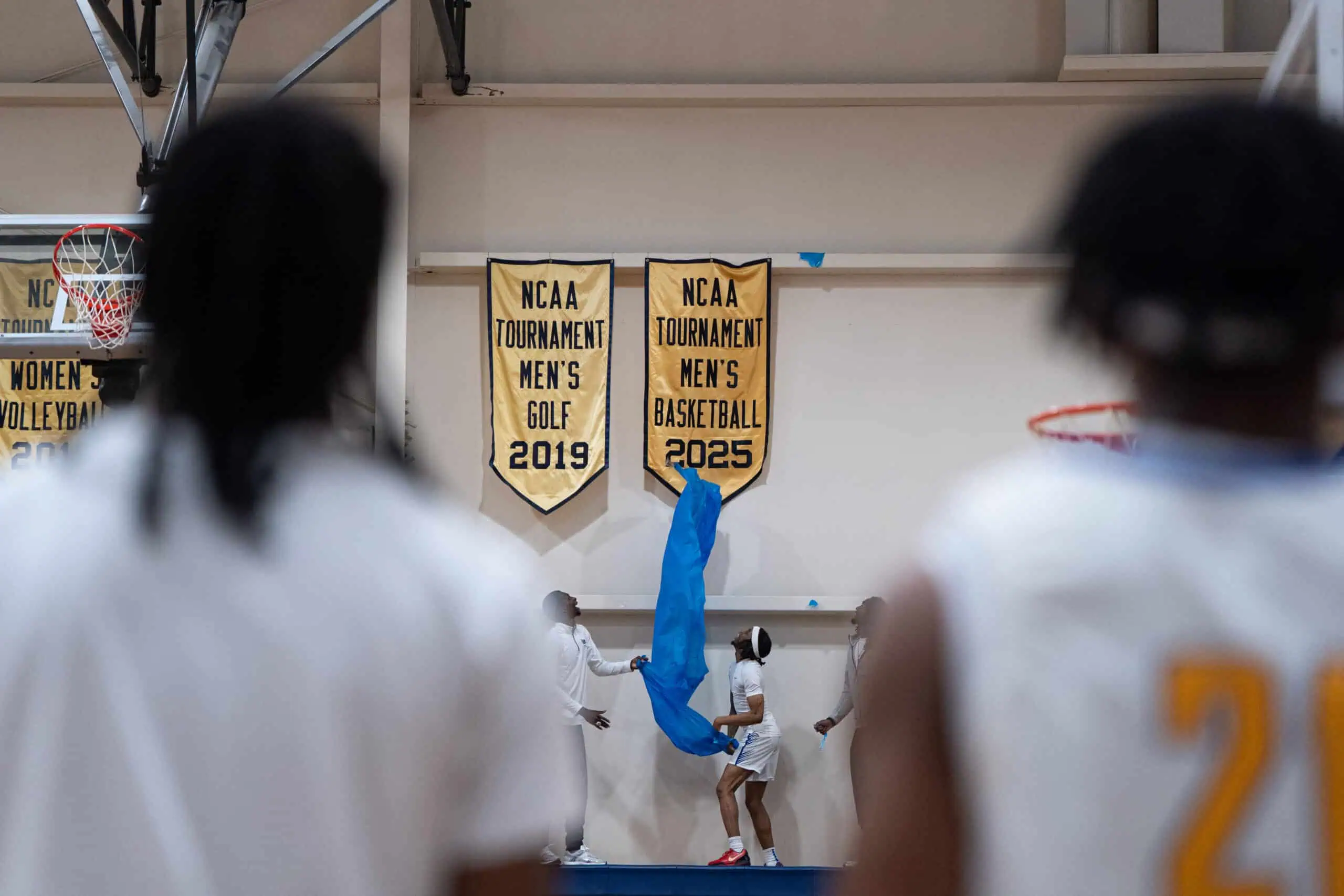 Taking to their home court for the first time this season, the University of Pittsburgh at Bradford's men's basketball team unveiled their 2024-2025 NCAA Division III Tournament banner ahead of their contest with Grove City. | Photo by Hunter O. Lyle