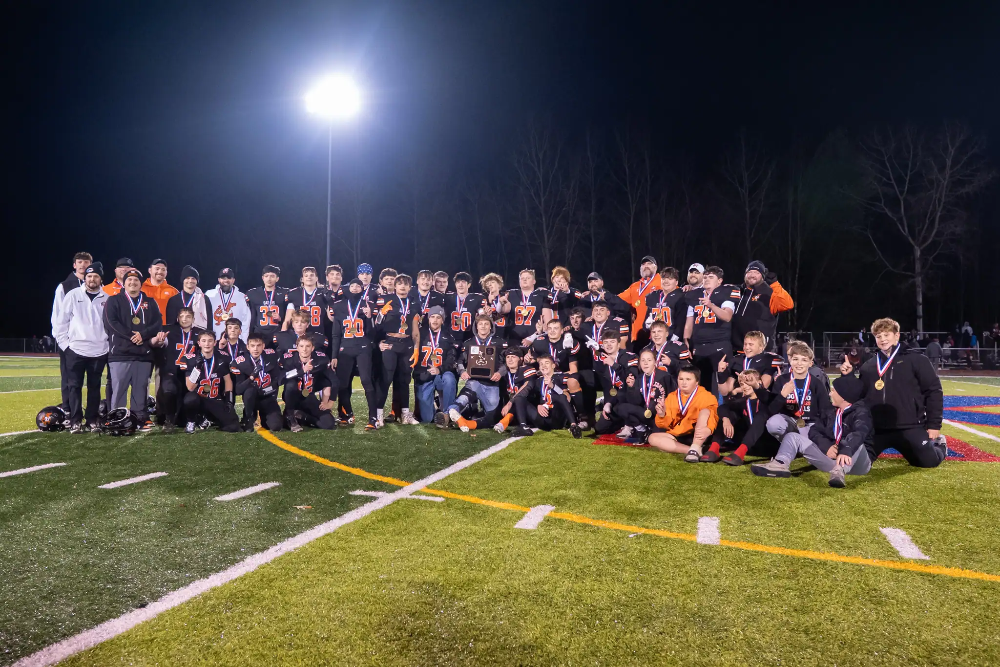 The Port Allegany football team poses with their newly acquired hardware after beating Redbank Valley in the District 9 Class A championship. With the win, the Gators become the first squad to win back-to-back titles in over a decade. | Photo by Hunter O. Lyle