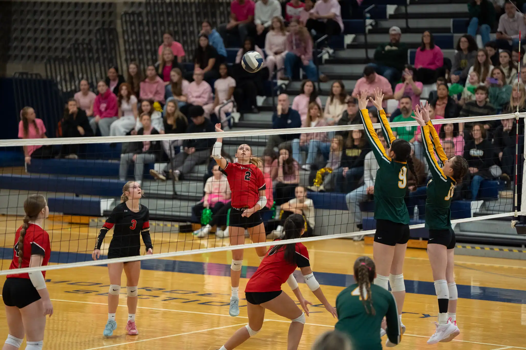 Alyx Henzel sends a shot over the net during Olean's season-ending loss to Charles G. Finney in the Far-West Regional. | Photo by Hunter O. Lyle