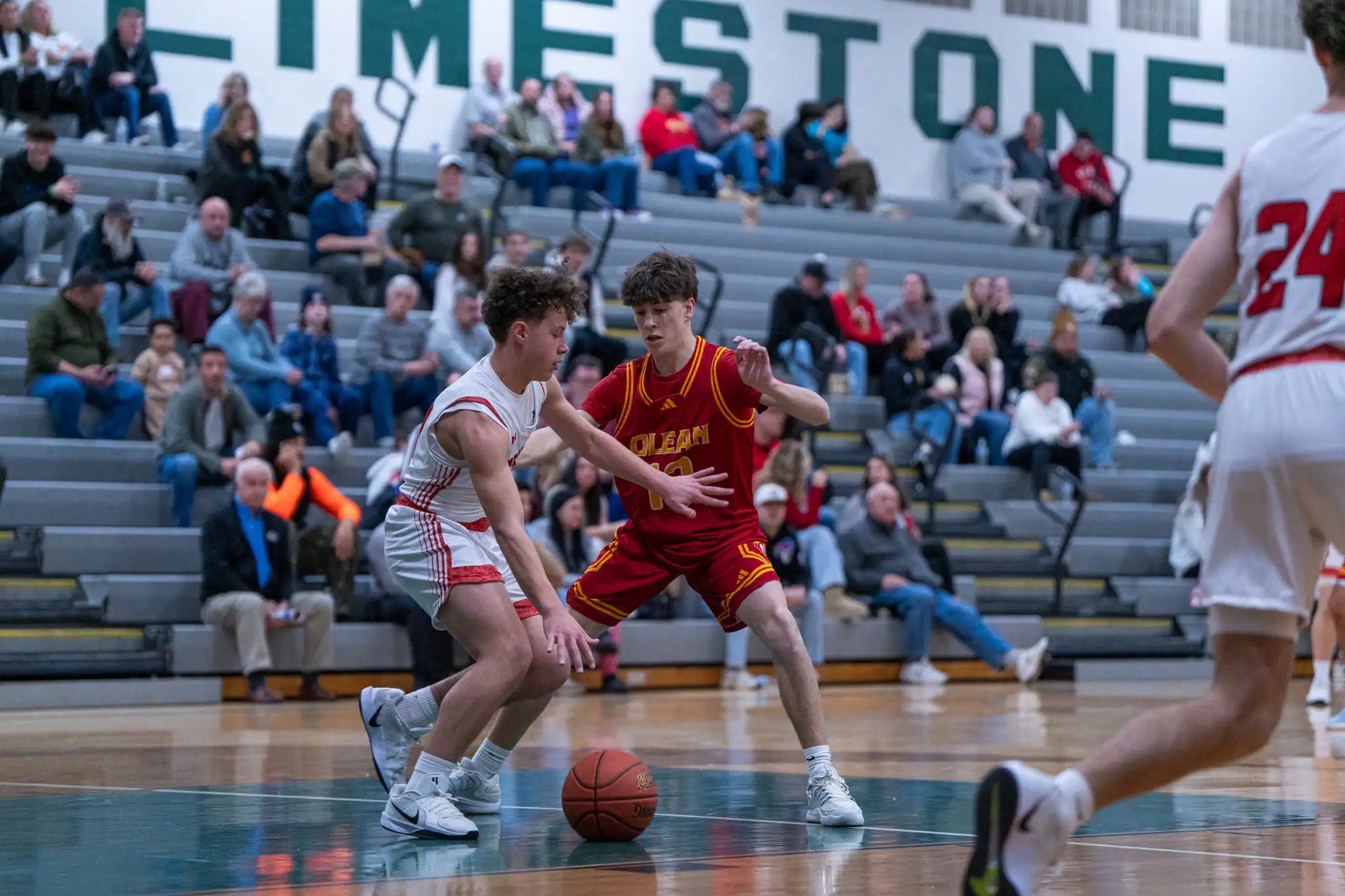 Olean's Liam Ruggles applies defensive pressure to Bradford's Trey Curcio during the Huskies' 50-25 win over the Owls. | Photo by Hunter O. Lyle