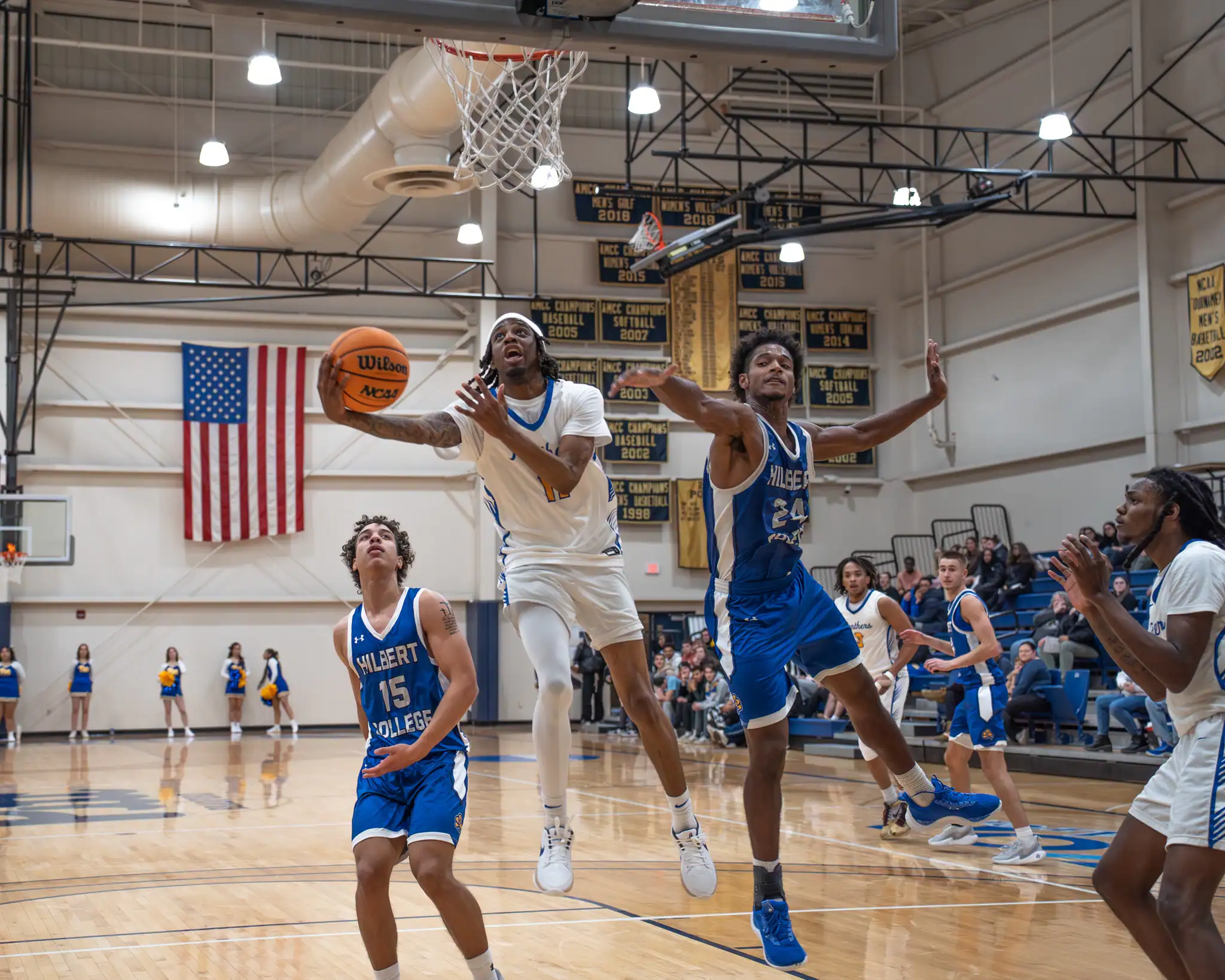 Pitt-Bradford's Coby Farley stretches out for an acrobatic layup during the Panthers' loss to Hilbert. Farley was one of four Panthers to reach double-digit scoring. | Photo by Taylor Komidar.