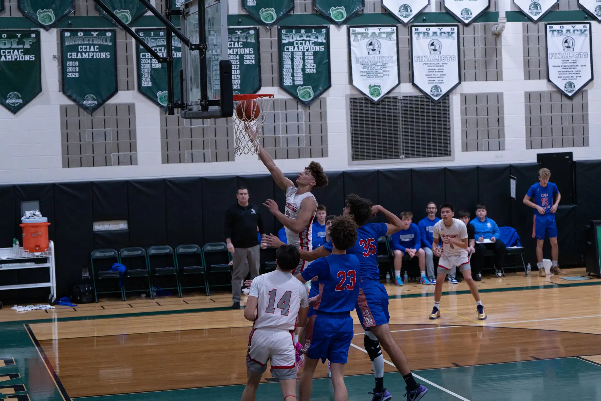 Payton Bradley rises to the rim during the Warriors' 36-point loss to Cuba-Rushford on Sunday. | Photo by Hunter O. Lyle