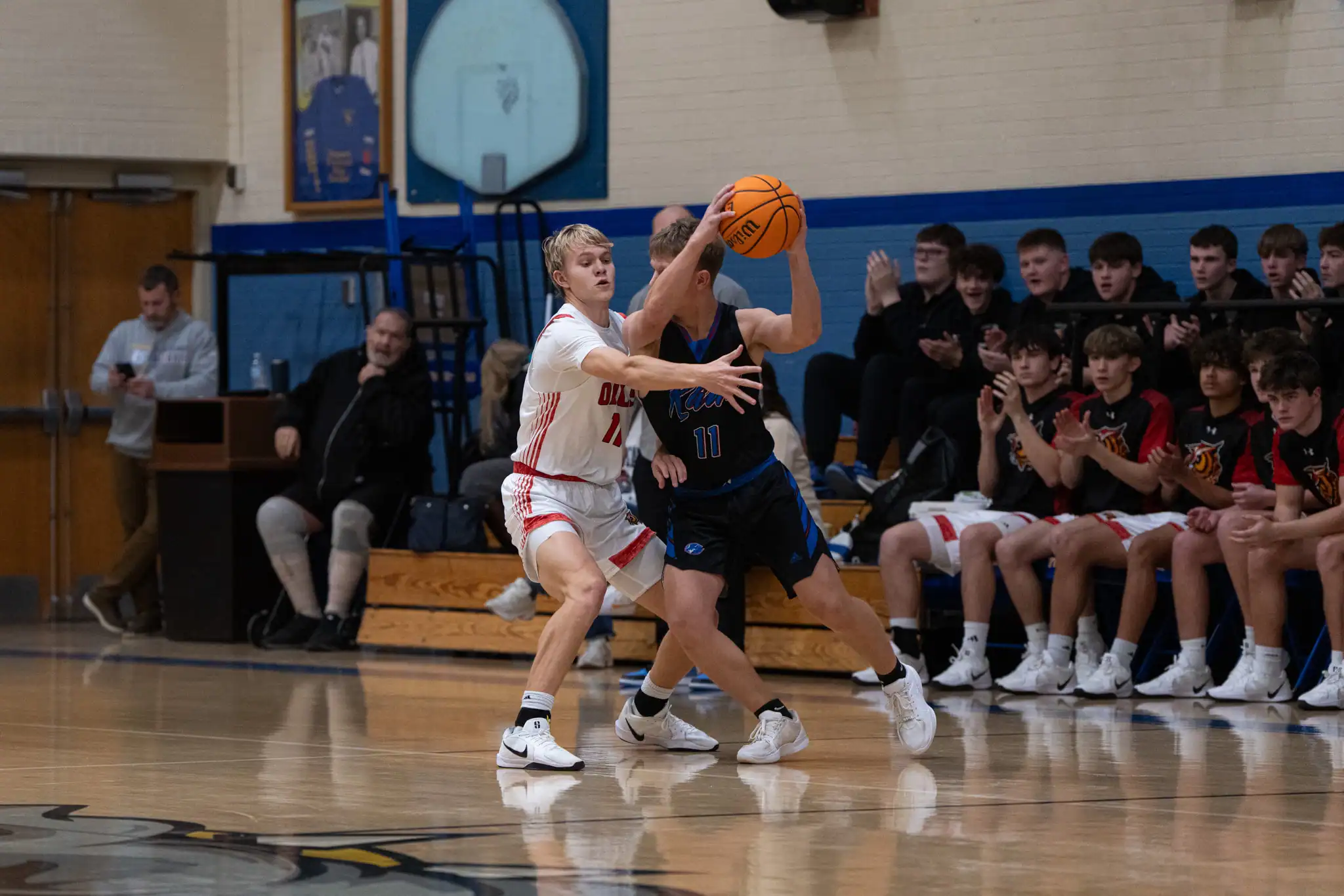 Bradford's Marcus Terwilliger (left) locks up a Kane ball handler during the Owls' win in the first day of the Randy Stebbins Memorial Tournament. | Photo by Hunter O. Lyle