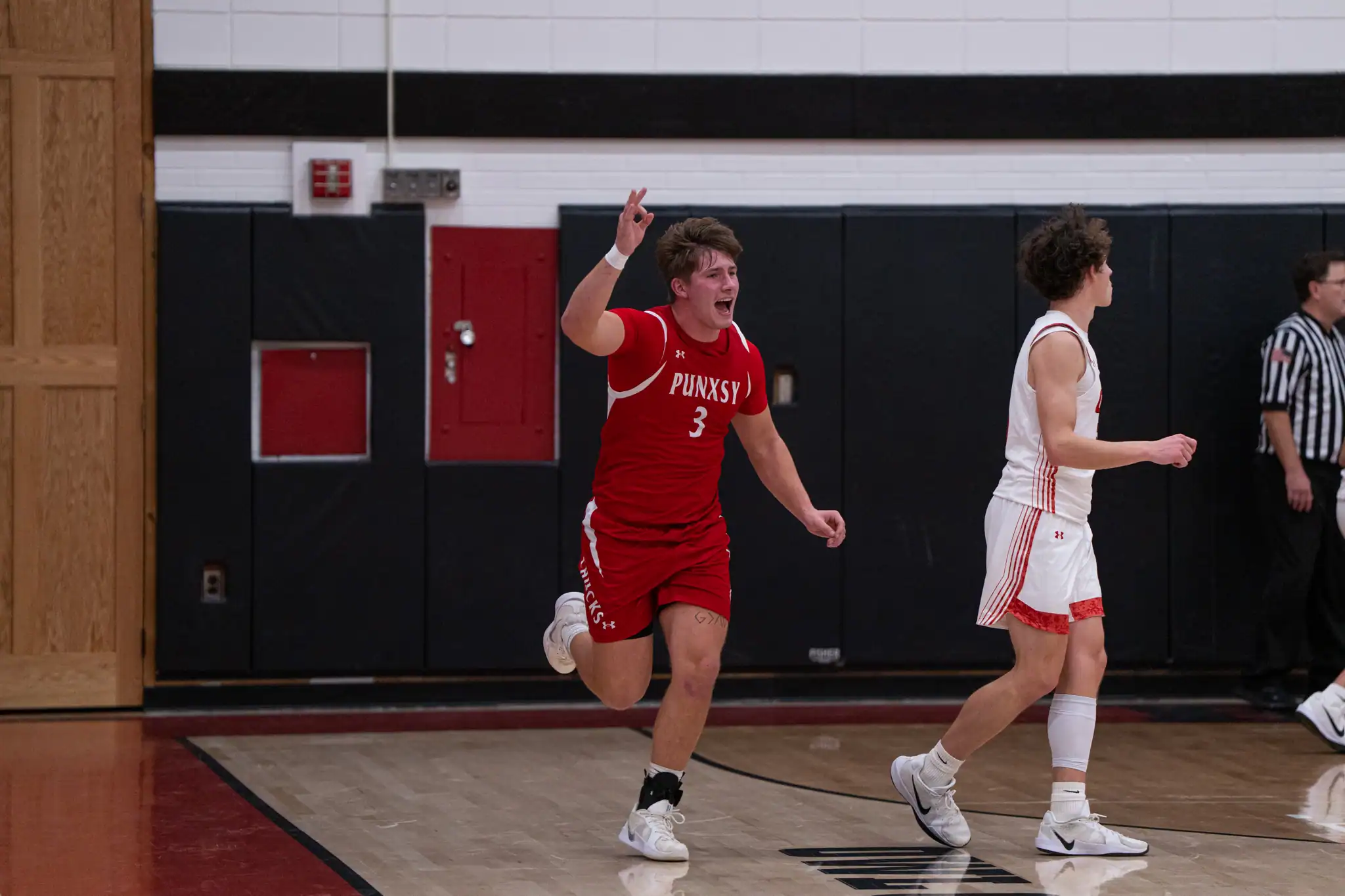 Punxsutawney's Beau Thomas celebrates after hitting a 3-pointer during the Chucks' comeback win over Bradford. During Punxsy's 21-point fourth quarter, they knocked down four triples to bury the Owls. | Photo by Hunter O. Lyle