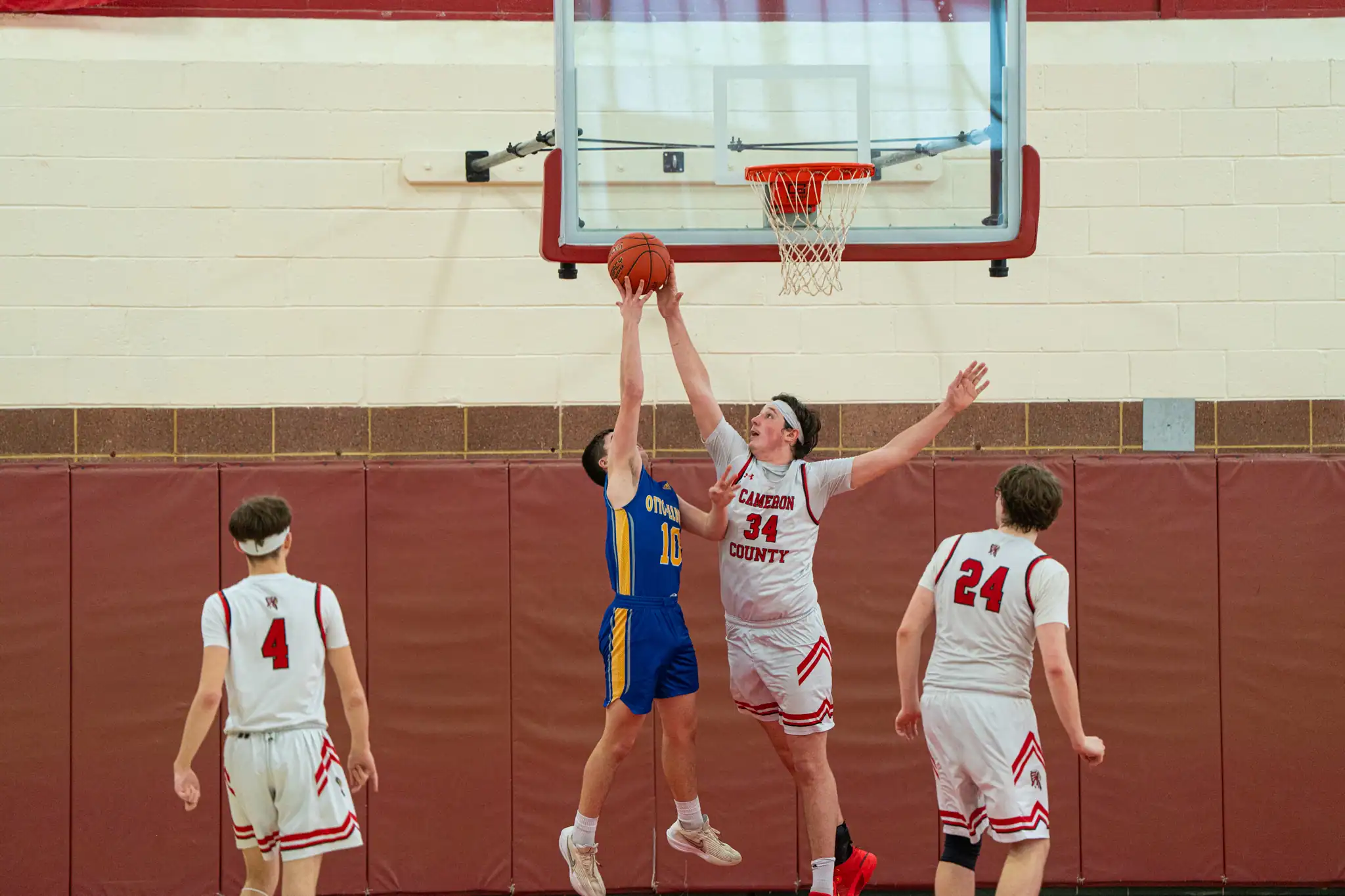 Cameron County's Isaac Grovanz sends back a shot from Otto-Eldred's Mason Schenfield during the second half of the Red Raiders' win over O-E. | Photo by Hunter O. Lyle