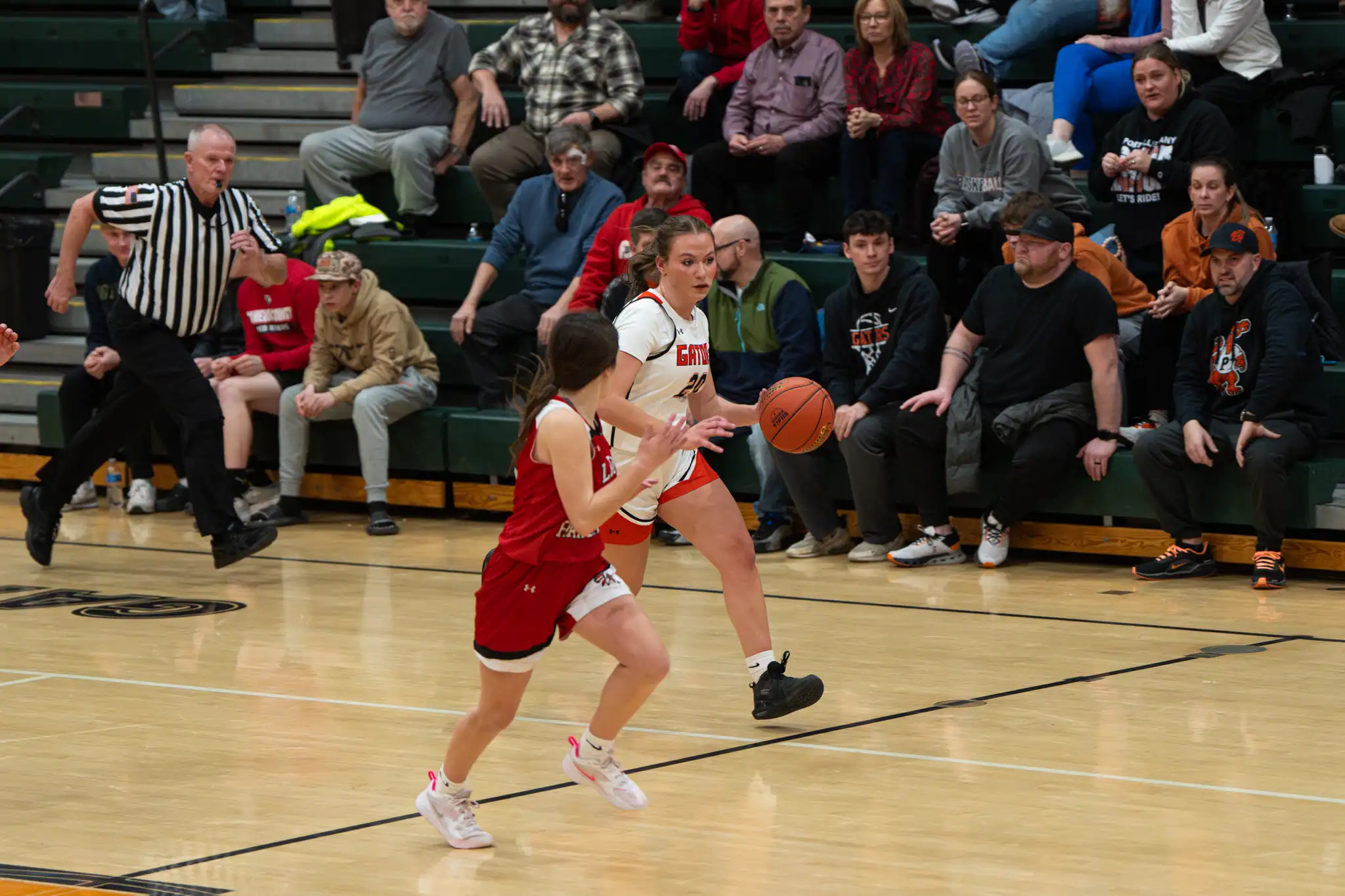 Peyton Gordon races up the court during the Lady Gators' win over Cam Co in the opening day of the North Tier League Tournament. | Photo by Hunter O. Lyle