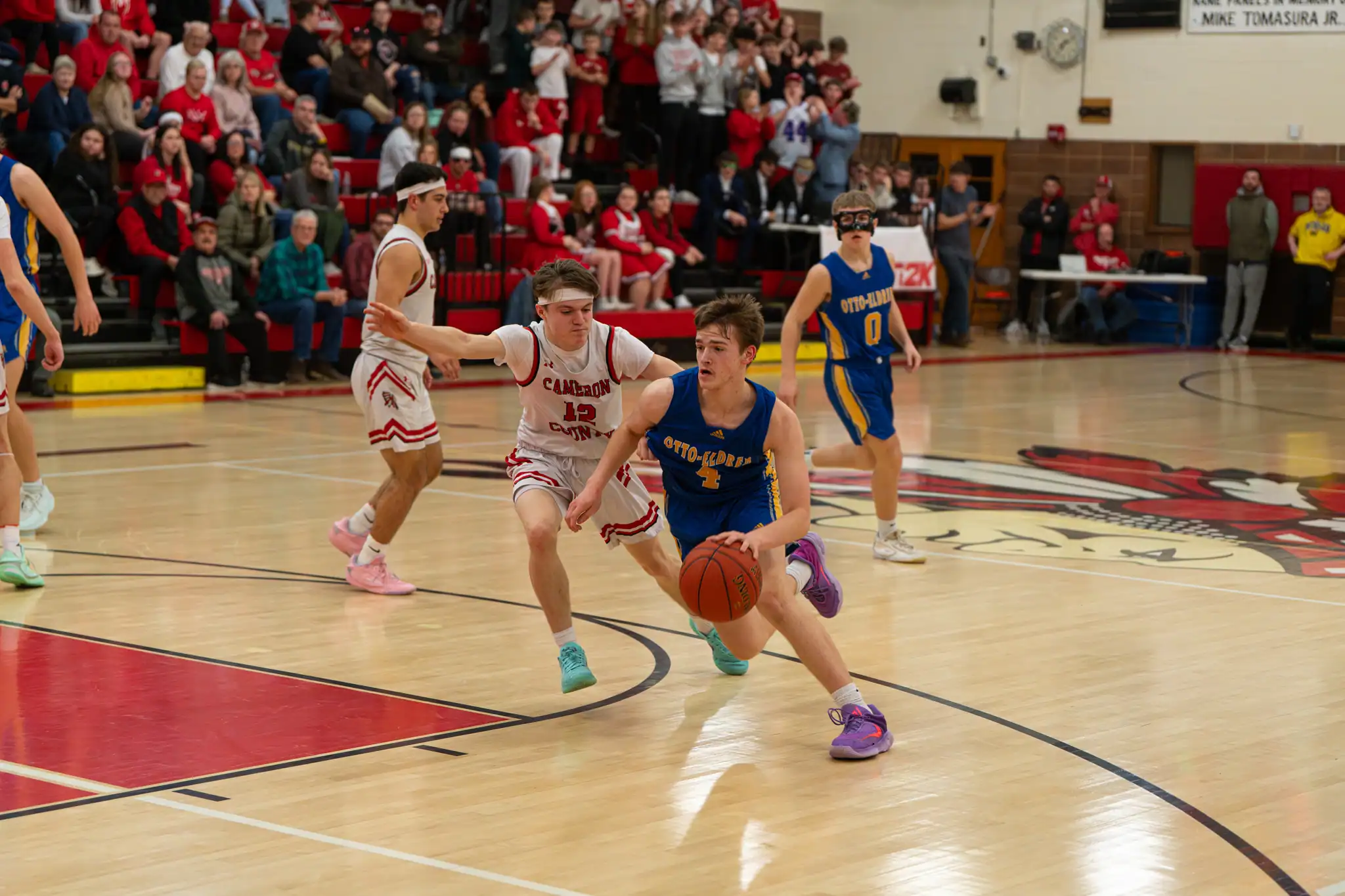 Michael Sheeler drives to the rim with Cam Co's Nick Goss in tow. | Photo by Hunter O. Lyle