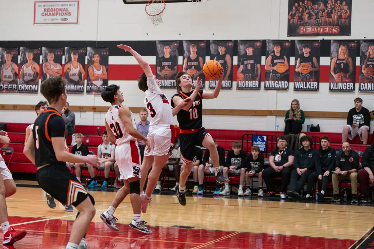 Nick Wilfong glides past a defender on his way to the basket during the opening minutes of Port Allegany's win over the Warriors. | Photo by Hunter O. Lyle