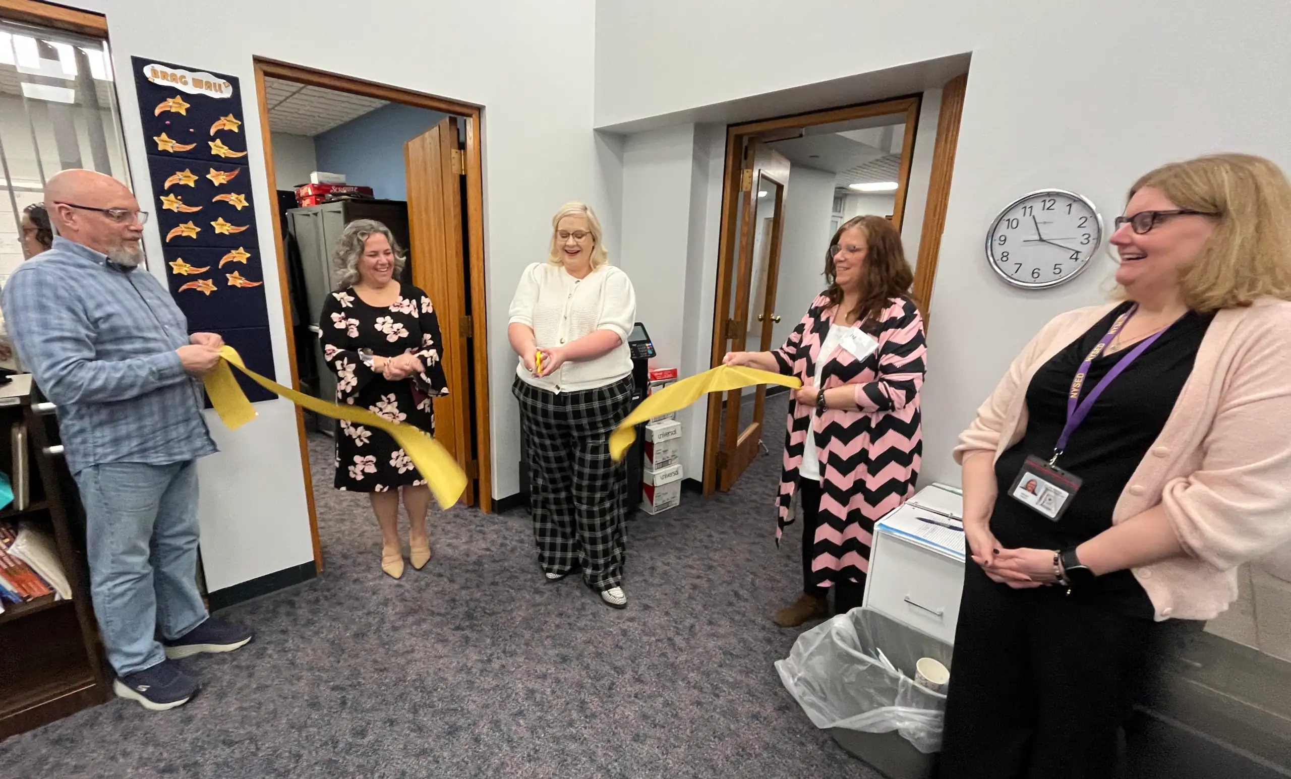 (Rick Miller/Olean Star) A ribbon cutting was held Friday at the new offices of CORE Learning Center in Blue Bird Square. From left are student Jacques Bourguignon, Mayor Amy B. Sherburne, Deputy Executive Director Sarah Mills, Mary Layman, data manager who oversees the Olean site and Deb Parrow, regional associate for adult education programs for the State Education Department.
