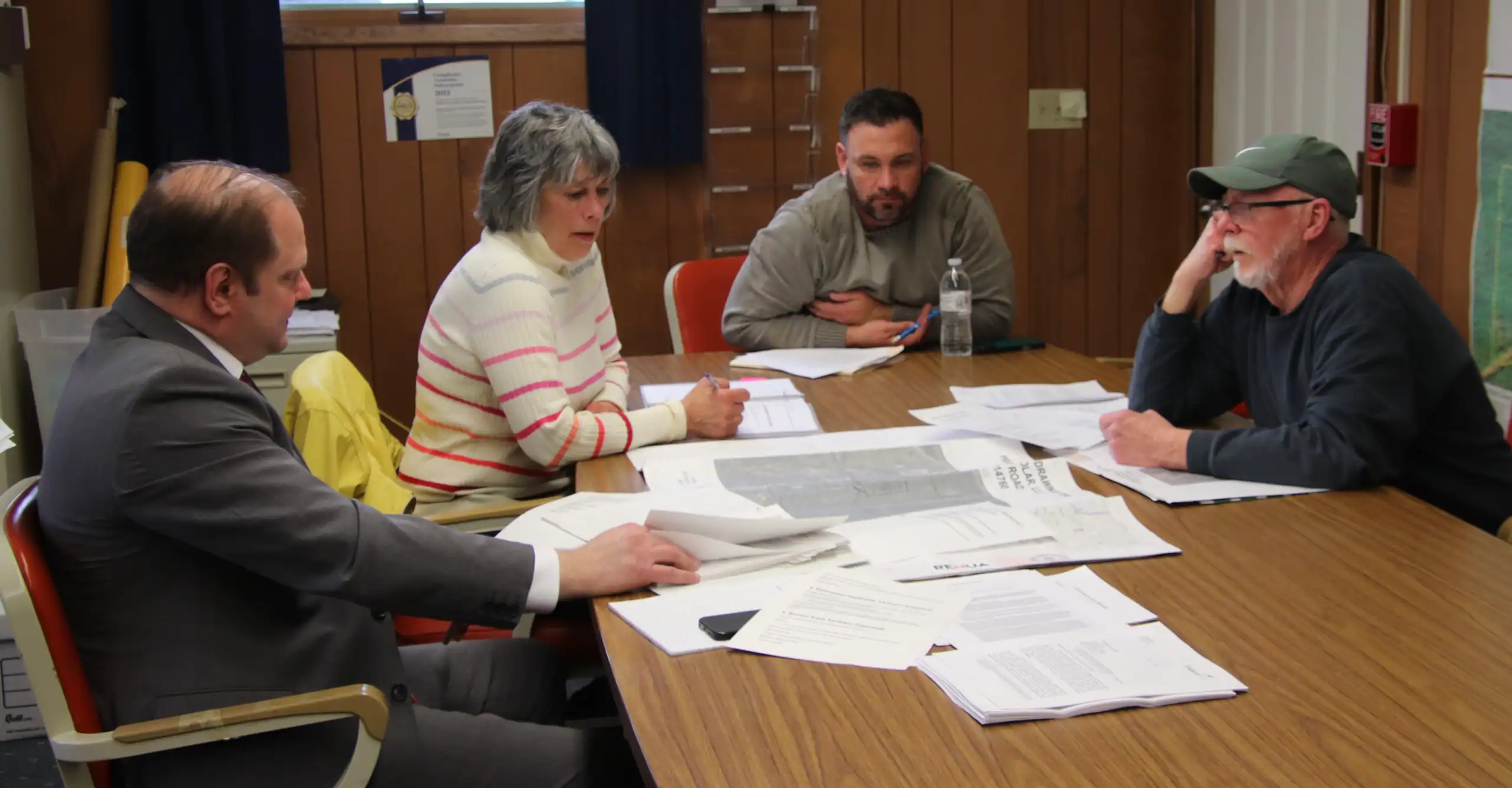 (Rick Miller/Olean Star) The Town of Olean Zoning Board of Appeals denied applications for variances from Dugan Road Solar for a solar farm Wednesday. From left are attorney Joshua Lippes, board members Pam Dominsky and Josh Anderson and chairman Ken Heitman.