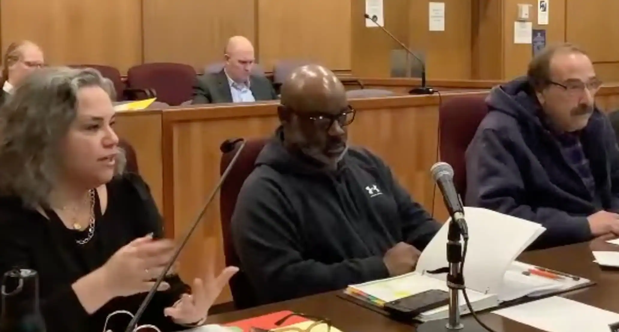 (City of Olean YouTube) Olean Mayor Amy B. Sherburne explains Tuesday that budget revisions have cut the proposed tax rate hike from 18.69% to 10.82%. Others from left are Council President Vernon Robinson Jr. and David Anastasia. The budget review continues Thursday.