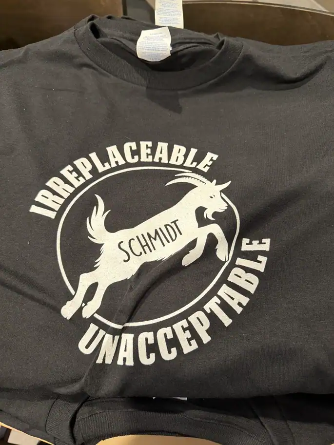 Fans are handing out T-Shirts ahead of the Davidson game honoring Schmidt as the GOAT.