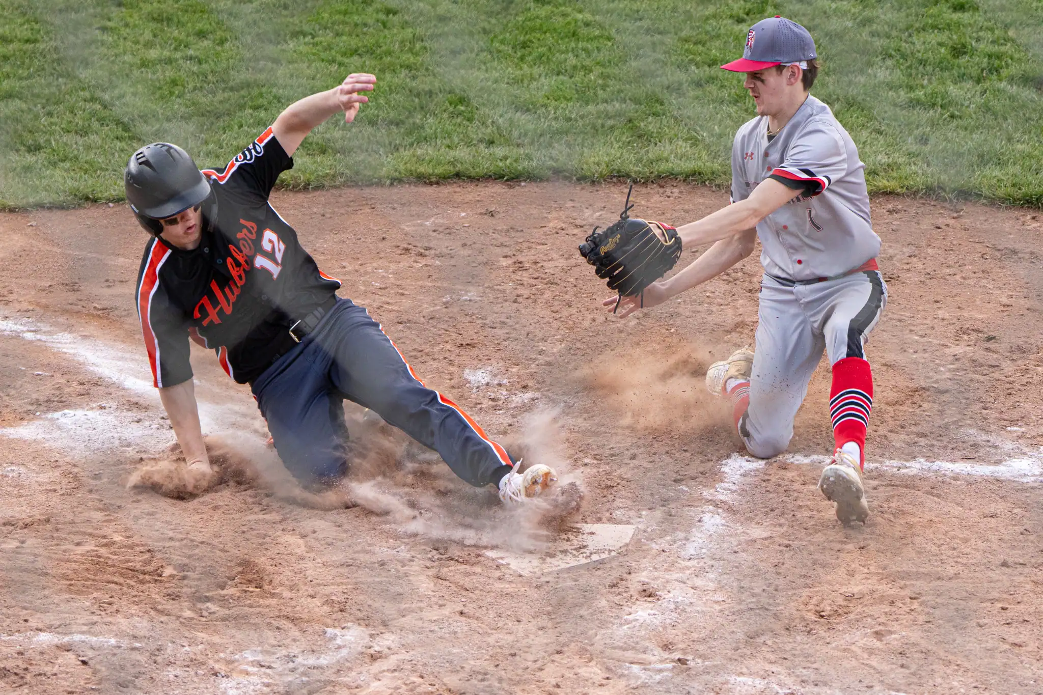 Smethport's Cole Burdick beats Cameron County's Taylon Tucker to home plate during the Hubbers win over the Red Raiders on Monday. | Photo by Hunter O. Lyle