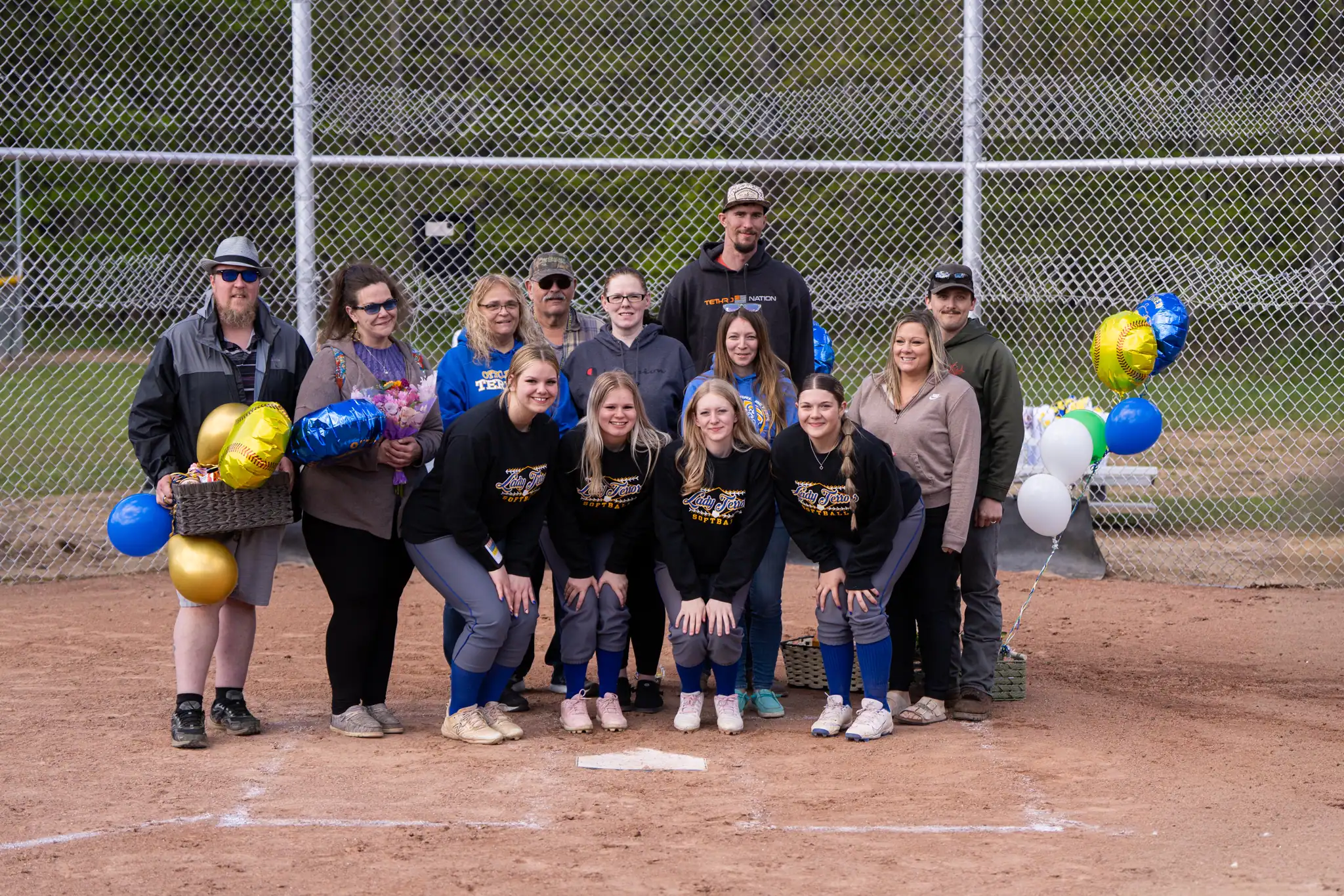 Ahead of their dominating win over Galeton, the Otto-Eldred softball team honored their four seniors. Pictured here with their family and coaches is Layla Horton, Arayah Holly, Payton Kaziska and Grace Rositzke. | Photo by Hunter O. Lyle