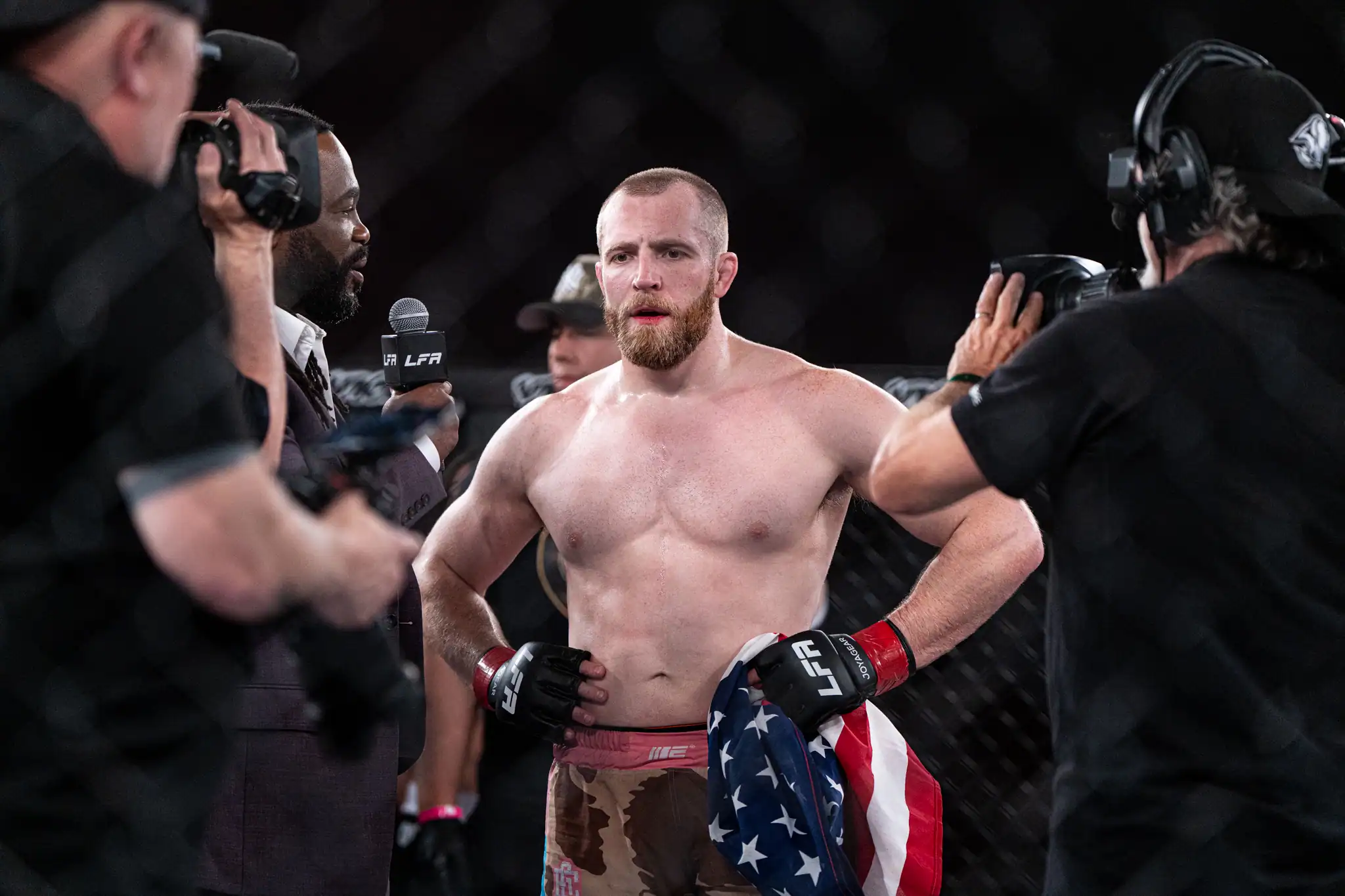 Jonathan Piersma stands victorious in the center of the octagon after defeating Digo Bianchini in LFA 233's main event. | Photo by Hunter O. Lyle