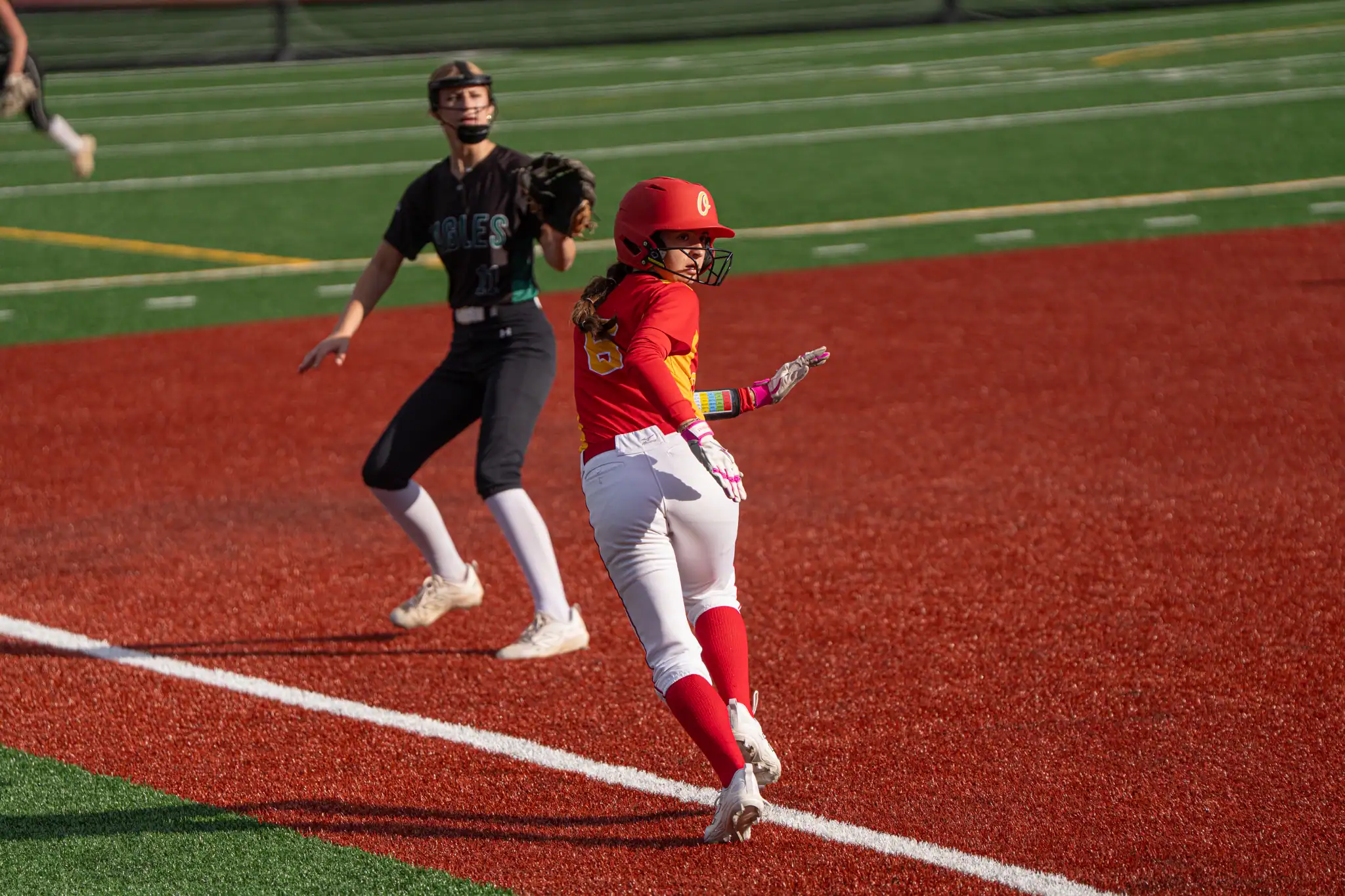 Alaina Hirliman scrambles between third and home during the Huskies' season-ending loss to Lake Shore in the Section VI quarterfinals. | Photo by Hunter O. Lyle