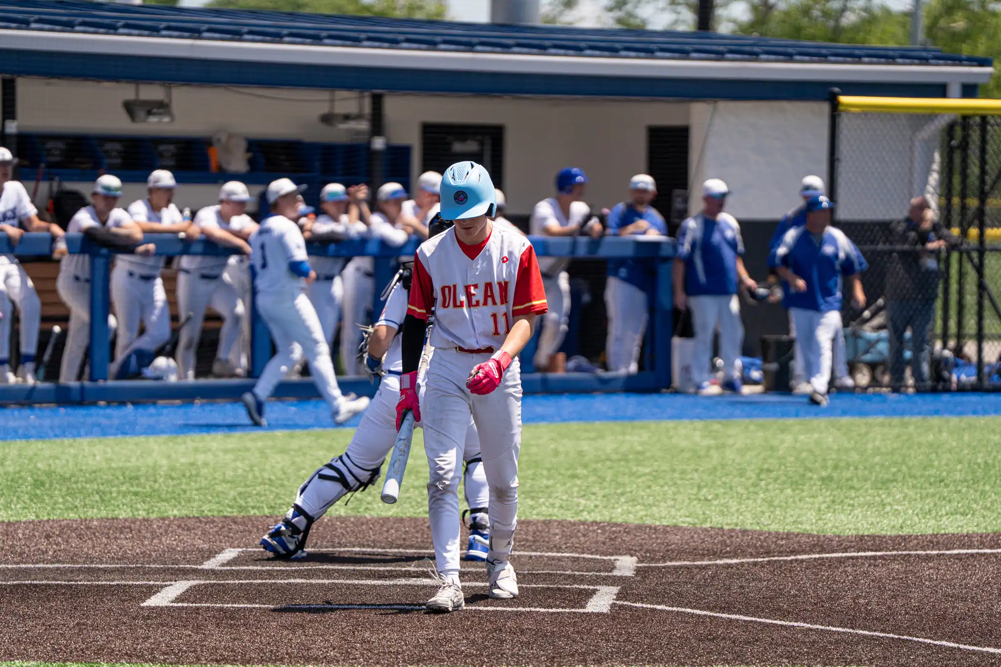 Dom Myers walks back to the dugout during an empty trip to the plate amidst the Huskies' season-ending loss to Grand Island in the Section VI Class A Crossover. | Photo by Hunter O. Lyle