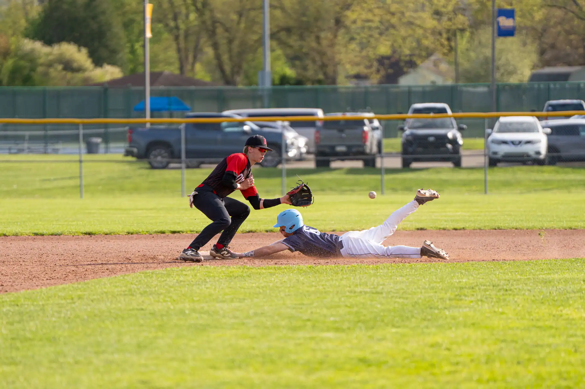 Bradford's second baseman, Lucas Wallace, tries to tag out a Warren baserunner during the Owls' Friday loss. | Photo by Hunter O. Lyle